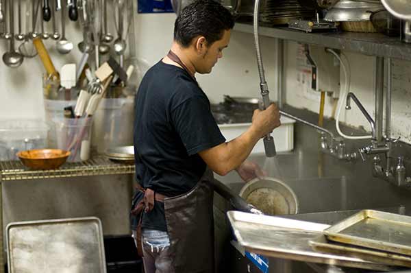 dishwasher-in-restaurant-kitchen dishwasher-in-restaurant-kitchen