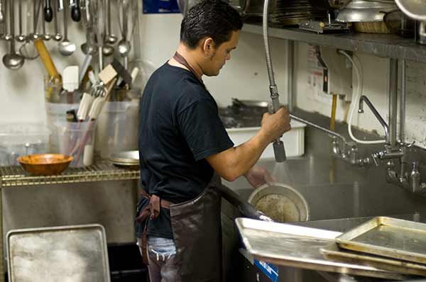 dishwasher-in-restaurant-kitchen