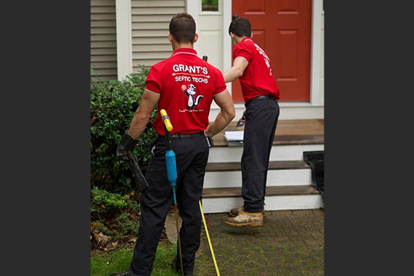 taking-measurements-for-septic-system-repair-600w taking-measurements-for-septic-system-repair-600w